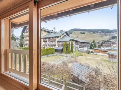 a window with a view of a town at Charmant 3 pièces au centre de Megève, idéal 4 pers - FR-1-453-96 in Megève