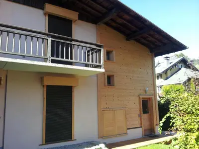 a house with a balcony and a porch at Charmant 3 pièces au centre de Megève, idéal 4 pers - FR-1-453-96 in Megève