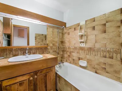 a bathroom with a sink and a bath tub and a mirror at Appartement 1 chambre à Megève - Animaux admis et parking - FR-1-453-98 in Megève