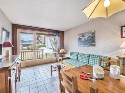 a living room with a couch and a table at Appartement 1 chambre à Megève - Animaux admis et parking - FR-1-453-98 in Megève