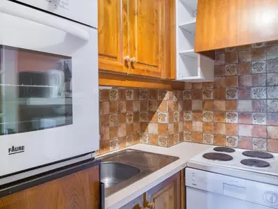 a kitchen with a sink and a stove at Appartement 1 chambre à Megève - Animaux admis et parking - FR-1-453-98 in Megève