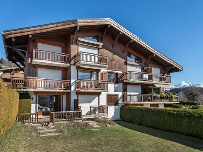 a large building with balconies on the side of it at Appartement 1 chambre à Megève - Animaux admis et parking - FR-1-453-98 in Megève