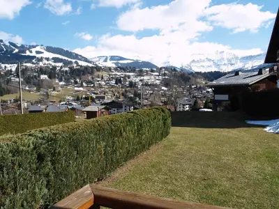 a view of a city from a house with a hedge at Appartement 1 chambre à Megève - Animaux admis et parking - FR-1-453-98 in Megève