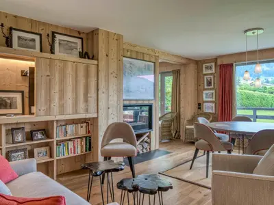 a living room with a table and chairs at Confortable Appartement 3 Chambres au Centre de Megève avec Wifi - FR-1-453-100 in Megève
