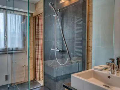 a bathroom with a shower and a sink at Confortable Appartement 3 Chambres au Centre de Megève avec Wifi - FR-1-453-100 in Megève