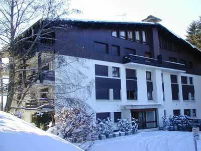 a large building with snow in front of it at Confortable Appartement 3 Chambres au Centre de Megève avec Wifi - FR-1-453-100 in Megève