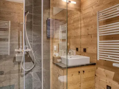 a bathroom with a sink and a shower at Confortable Appartement 3 Chambres au Centre de Megève avec Wifi - FR-1-453-100 in Megève