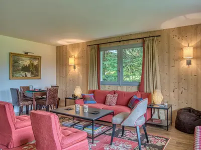 a living room with a red couch and chairs at Confortable Appartement 3 Chambres au Centre de Megève avec Wifi - FR-1-453-100 in Megève