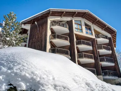 a snow pile in front of a building at Appartement 2 Chambres Megève, Balcon Sud, Parking, Wifi - FR-1-453-101 in Megève