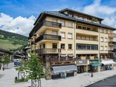a large building with balconies on the side of it at Appartement 2 chambres en centre-ville à Megève avec balcon et wifi - FR-1-453-107 in Megève
