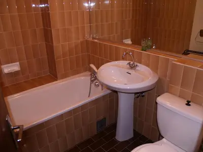 a bathroom with a sink and a toilet and a tub at Studio à Megève - 3 personnes, Animaux admis - FR-1-453-116 in Megève