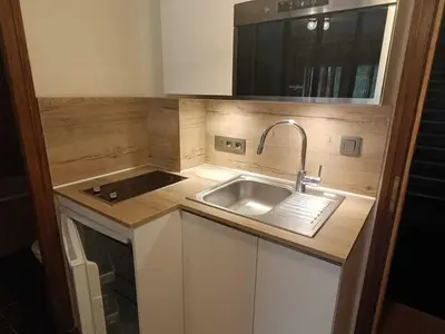 a small kitchen with a sink and a stove at Studio à Megève - 3 personnes, Animaux admis - FR-1-453-116 in Megève