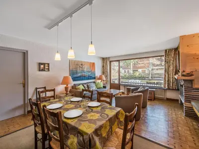 a dining room with a table and chairs at Appartement 2 pièces au cœur de Megève avec balcon et parking - FR-1-453-118 in Megève