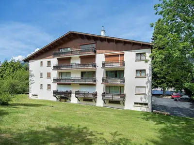 a building with balconies on the side of it at Appartement 2 pièces au cœur de Megève avec balcon et parking - FR-1-453-118 in Megève