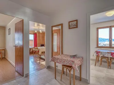 a living room with a table and a dining room at Appartement 2 pièces avec balcon et parking à Megève - FR-1-453-120 in Megève