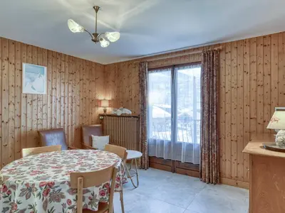 a dining room with a table and a window at Appartement cosy 1 chambre à Megève avec WiFi et parking - FR-1-453-122 in Megève