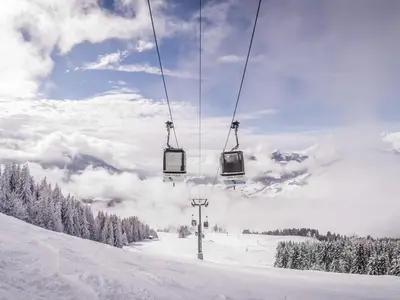 a ski lift going up a snow covered slope at Appartement cosy 1 chambre à Megève avec WiFi et parking - FR-1-453-122 in Megève
