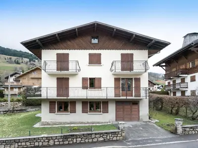 a building with balconies on the side of it at Appartement cosy 1 chambre à Megève avec WiFi et parking - FR-1-453-122 in Megève