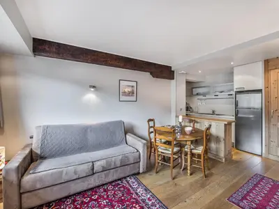 a living room with a couch and a table at Charmant T2 au cœur de Megève pour 3 personnes - FR-1-453-106 in Megève
