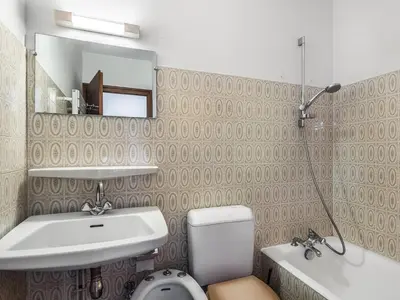 a bathroom with a sink and a toilet and a mirror at Studio à Megève Rochebrune, à 10 min du centre, pour 2 personnes - FR-1-453-124 in Megève