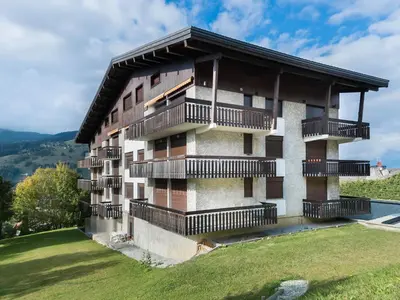 a building on a hill with balconies on it at Studio à Megève Rochebrune, à 10 min du centre, pour 2 personnes - FR-1-453-124 in Megève