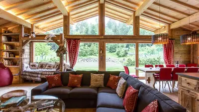 a large living room with a couch and a table at Chalet Chal'heureux in Chamonix-Mont-Blanc