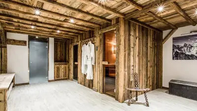 a room with wooden walls and a dressing room at Chalet Chal'heureux in Chamonix-Mont-Blanc