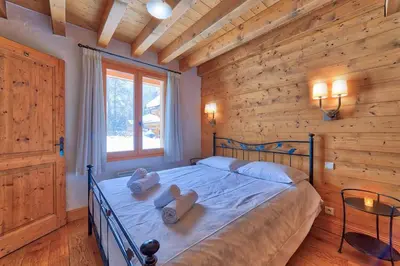 a bedroom with a bed with teddy bears on it at Chalet Coralie in Chamonix-Mont-Blanc