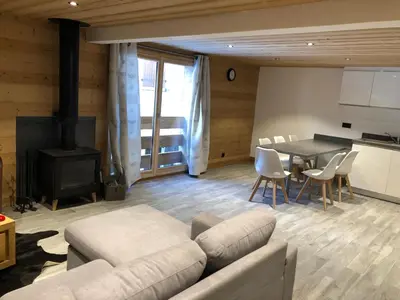 a living room with a couch and a table at Chalet Victoire in Chamonix-Mont-Blanc