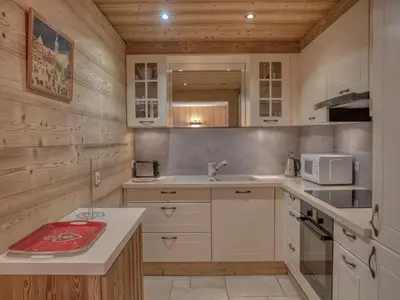 a kitchen with a sink and a microwave at Appartement confort 2 pièces Megève - Wifi, Parking - FR-1-453-125 in Megève