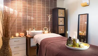 a bedroom with a bed and a sink and a mirror at Hôtel Club MMV Le Flaine in Flaine