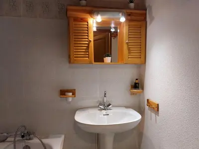 a bathroom with a sink and a mirror at Apartment Martagon-2 by Interhome in Saint-Gervais-les-Bains