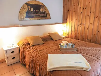 a bed with a tray on top of it at Apartment Jardins Alpins 8 by Interhome in Saint-Gervais-les-Bains