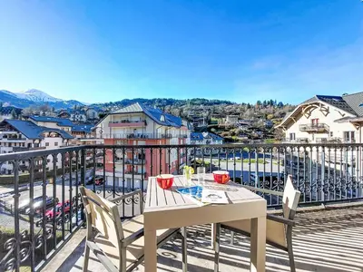 a table and chairs on a balcony with a view at Apartment Le Grand Panorama 412 by Interhome in Saint-Gervais-les-Bains