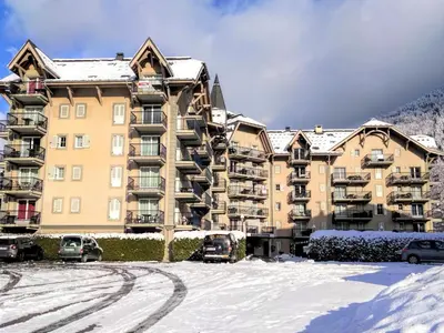 an apartment building with a street light in front of it at Apartment Le Grand Panorama 412 by Interhome in Saint-Gervais-les-Bains