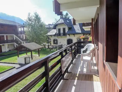 a balcony with a view of a house at Apartment Les Jardins du Mont-Blanc-5 by Interhome in Chamonix-Mont-Blanc