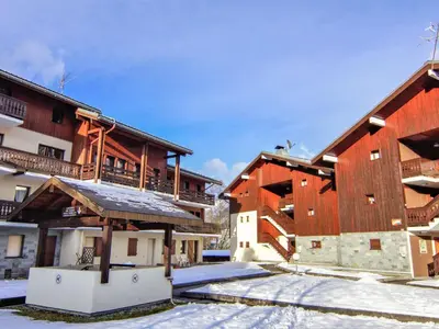 a group of buildings with snow on the ground at Apartment Les Jardins du Mont-Blanc-5 by Interhome in Chamonix-Mont-Blanc