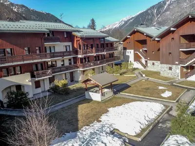 a group of buildings with snow on the ground at Apartment Les Jardins du Mont-Blanc-5 by Interhome in Chamonix-Mont-Blanc