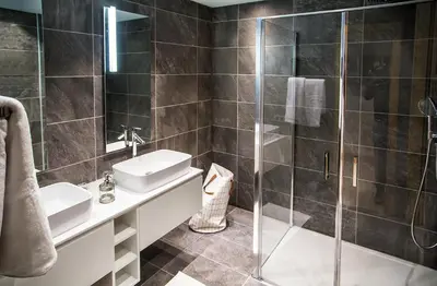 a bathroom with a sink and a shower at Winter Vacances - Megève excellent apartment - AE 301 in Megève