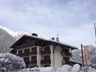 a building with snow on the roof of it at Oustalet in Chamonix-Mont-Blanc