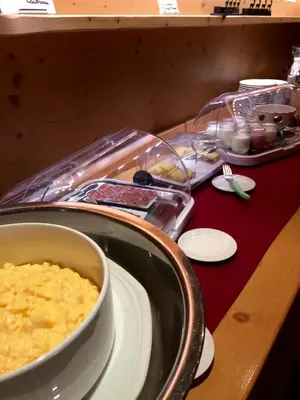 a table with a bowl of food on a table at Oustalet in Chamonix-Mont-Blanc