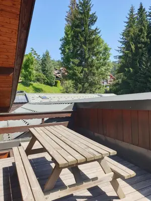 a picnic table on the roof of a house at Demi-Chalet Le Bief --Prox pistes in Les Carroz d'Araches