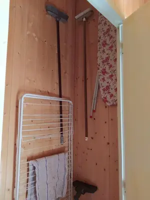 a room with a wooden wall with a towel rack at Demi-Chalet l'Ancolie -- Prox pistes in Les Carroz d'Araches