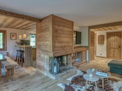 a living room with a fireplace in a house at Appartement 3 pièces avec parking à Megève Rochebrune - FR-1-453-166 in Megève