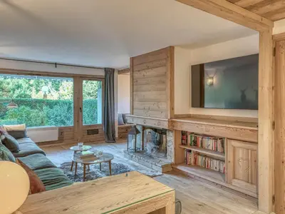 a living room with a fireplace and a tv at Appartement 3 pièces avec parking à Megève Rochebrune - FR-1-453-166 in Megève