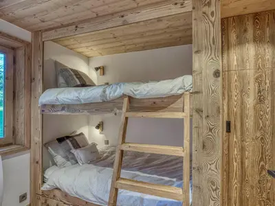 a bunk bed in a tiny house at Appartement 3 pièces avec parking à Megève Rochebrune - FR-1-453-166 in Megève