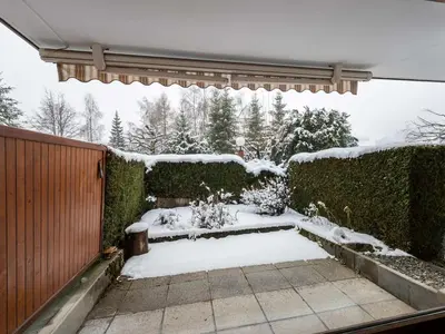 a garden covered in snow with a fence at Appartement 3 pièces avec parking à Megève Rochebrune - FR-1-453-166 in Megève