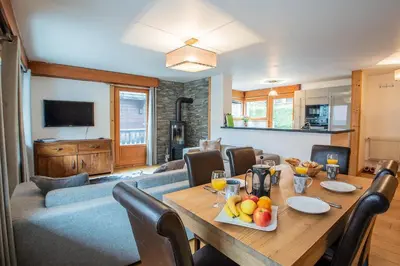 a dining room with a table with fruit on it at Mintaka Apartment - Chamonix in Chamonix-Mont-Blanc