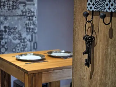 a wooden table with plates and dishes on it at Chalet Arpitan - les Carroz - Grand Massif in Les Carroz d'Araches