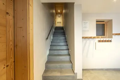 a stairway in a building with a hallway at Chalet Arpitan - les Carroz - Grand Massif in Les Carroz d'Araches